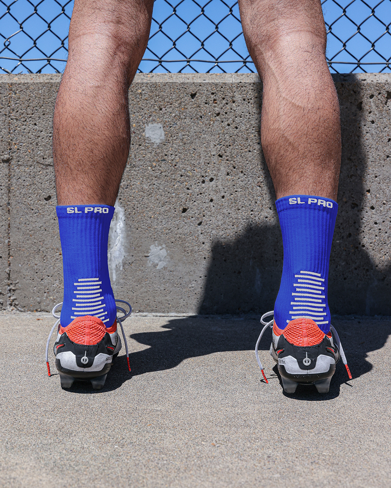 SL PRO Grip Socks Blue Back View with Cleats